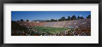 Framed High angle view of spectators watching a football match in a stadium, Rose Bowl Stadium, Pasadena, California