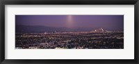 Framed Buildings in a city lit up at dusk, Hollywood, San Gabriel Mountains, City Of Los Angeles, Los Angeles County, California, USA