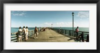 Framed Tourists on the beach at Coney Island viewed from the pier, Brooklyn, New York City, New York State, USA