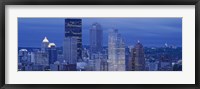 Framed High angle view of skyscrapers lit up at dusk, Pittsburgh, Pennsylvania, USA