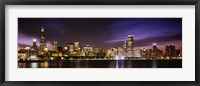 Framed Buildings at the waterfront lit up at night, Chicago, Illinois