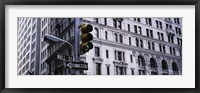 Framed Low angle view of a Green traffic light in front of a building, Wall Street, New York City