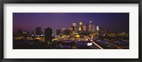 Framed Skyscrapers lit up at dusk, Minneapolis, Minnesota, USA