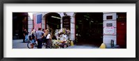 Framed Rear view of three people standing in front of a memorial at a fire station, New York City, New York State, USA