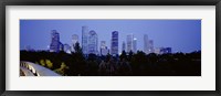 Framed Buildings lit up at dusk, Houston, Texas