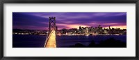 Framed Bridge lit up at dusk, Bay Bridge, San Francisco Bay, San Francisco, California