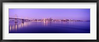 Framed Bay Bridge with a lit up city skyline in the background, San Francisco, California, USA