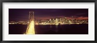 Framed Bay Bridge and San Francisco skyline at night, California