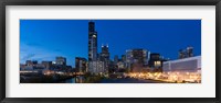 Framed Buildings in a city lit up at dusk, Chicago, Illinois, USA