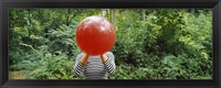 Framed Woman blowing a balloon, Germany