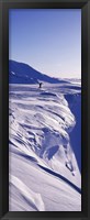 Framed Person walking on a snow covered mountain, Snaefellsnes Peninsula, Iceland