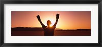 Framed Silhouette of a person wearing boxing gloves in a desert at dusk, Black Rock Desert, Nevada, USA