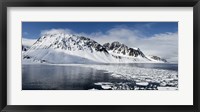 Framed Ice floes on water with a mountain range in the background, Magdalene Fjord, Spitsbergen, Svalbard Islands, Norway