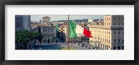 Framed Italian flag fluttering with city in the background, Piazza Venezia, Vittorio Emmanuel II Monument, Rome, Italy
