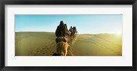 Framed Row of people riding camels through the desert, Sahara Desert, Morocco