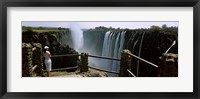 Framed Woman looking at the Victoria Falls from a viewing point, Zambia