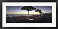 Framed Beach chairs and straw sun umbrellas on Patara Beach on the Mediterranean Sea at sunset, Patara, Antalya Province, Turkey