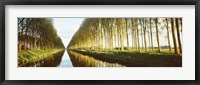 Framed Belgium, tree lined waterway through countryside