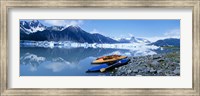 Framed USA, Alaska, Kayaks by the side of a river