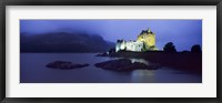 Framed Castle lit up at dusk, Eilean Donan Castle, Loch Duich, Dornie, Highlands Region, Scotland