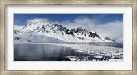 Framed Ice floes on water with a mountain range in the background, Magdalene Fjord, Spitsbergen, Svalbard Islands, Norway