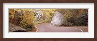 Framed Road curving around a big boulder, Stowe, Lamoille County, Vermont, USA