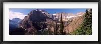 Framed Trees with a mountain range in the background, US Glacier National Park, Montana, USA