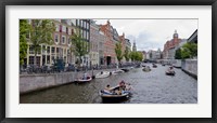 Framed Tourboats in a canal, Amsterdam, Netherlands