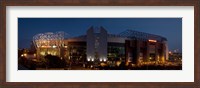 Framed Football stadium lit up at night, Old Trafford, Greater Manchester, England