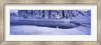 Framed River flowing through a snow covered forest, Dal River, Sweden