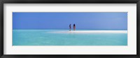 Framed Two women standing on the beach sandbar, Maayafushi Island, Ari Atoll, Maldives