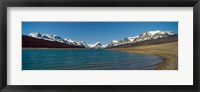 Framed Lake with snow covered mountains in the background, Sherburne Lake, US Glacier National Park, Montana, USA