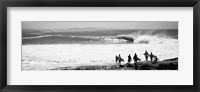 Framed Silhouette of surfers standing on the beach, Australia (black and white)