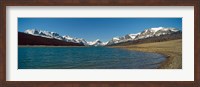 Framed Lake with snow covered mountains in the background, Sherburne Lake, US Glacier National Park, Montana, USA