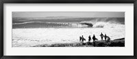 Framed Silhouette of surfers standing on the beach, Australia (black and white)