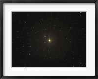 Framed red giant star Beta Andromedae and its ghost galaxy NGC 404