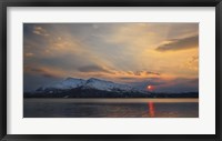 Framed Midnight Sun over Tjeldsundet strait in Troms County, Norway