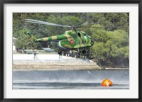 Framed Bulgarian Air Force Mi-17 taking water with Bambi Bucket