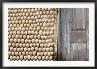 Framed Cowrie shells on wall of building, Ibo Island, Morocco