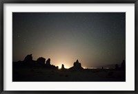 Framed Large tufa formations at Trona Pinnacles against a backdrop of stars