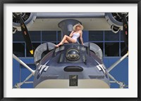 Framed Retro pin-up girl posing with a World War II era PBY Catalina seaplane