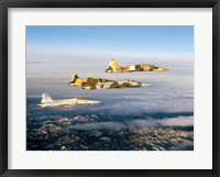 Framed Four F-5 Tiger II's fly above Southern California