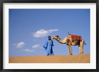 Framed Man leading camel on sand dunes, Tinfou (near Zagora), Morocco, Africa