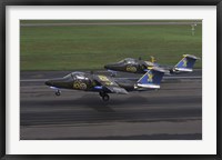 Framed Saab 105 jet trainers on the strip