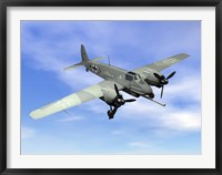 Framed World War II era German aircraft with swastika flying in the sky