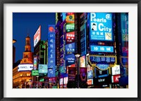 Framed neon signs along the shopping and business center at night, Nanjing Road, Shanghai, China