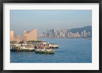 Framed Kowloon ferry terminal and clock tower, Hong Kong, China