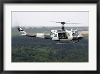 Framed US Air Force UH-1H Huey in an experiment paint scheme