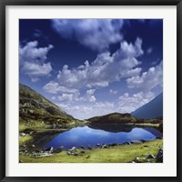 Framed Blue lake in the Pirin Mountains over tranquil clouds, Pirin National Park, Bulgaria