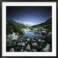 Framed Small river flowing through big stones in Pirin National Park, Bulgaria